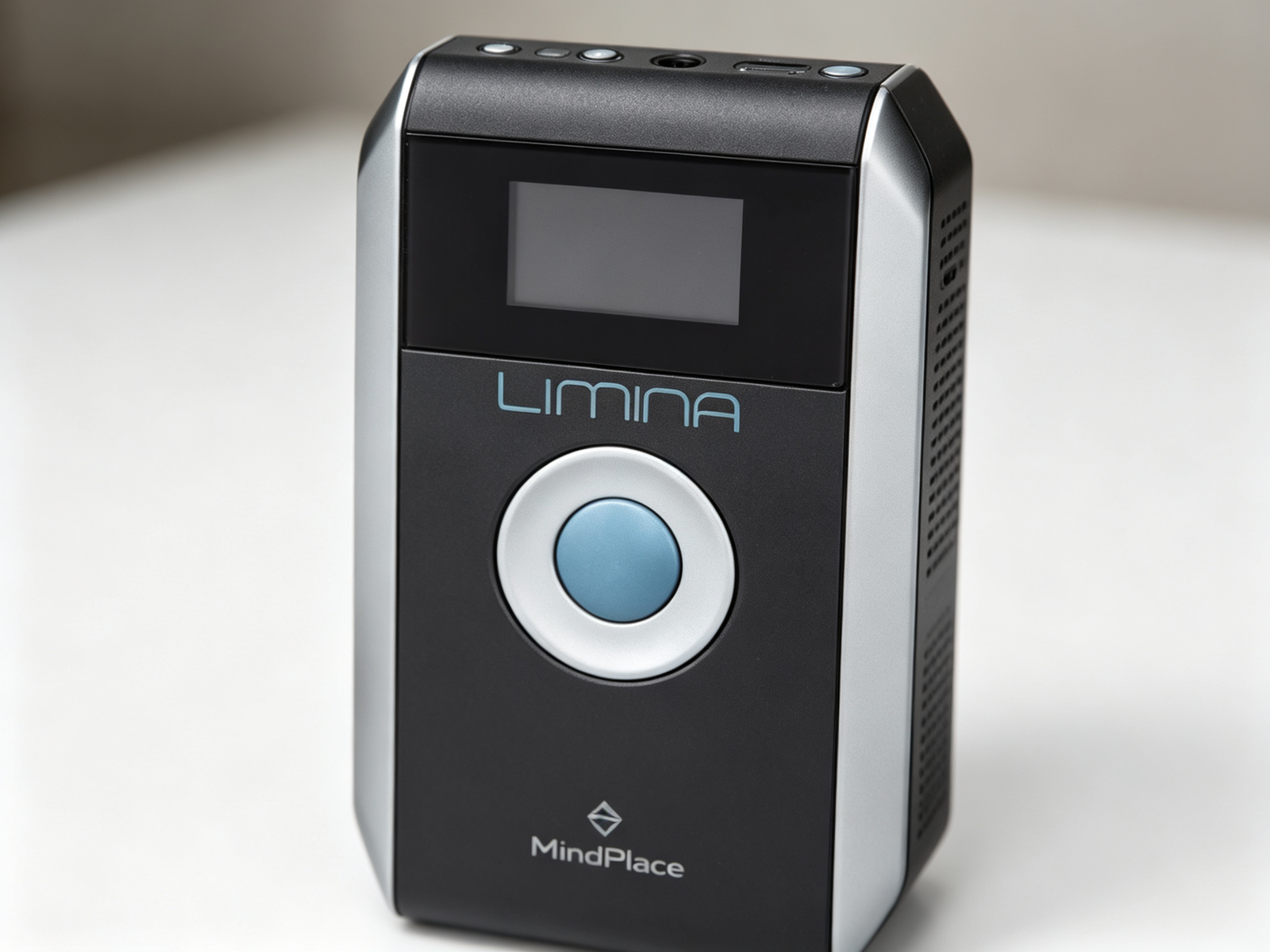 Close-up of MindPlace Limina AVS main unit showing its monochrome LCD display screen and control buttons