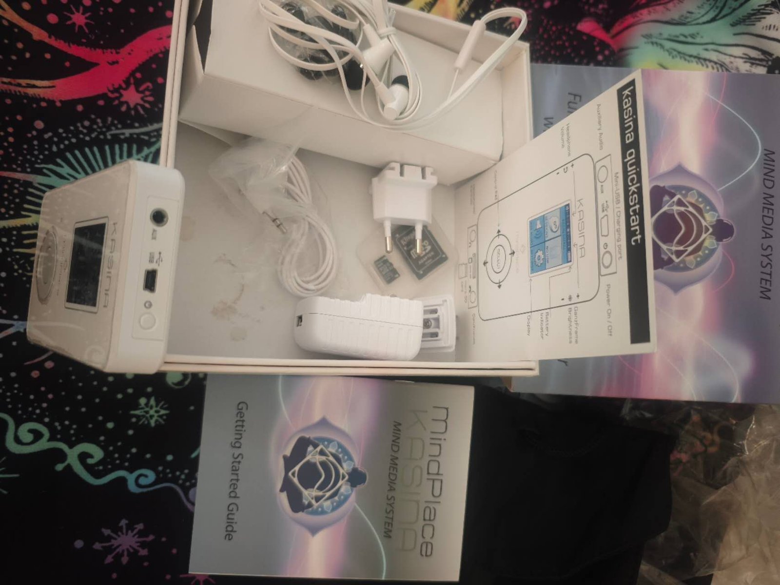 MindPlace Kasina unboxing photo showing host, quickstart guide, charger, memory card and kit accessories